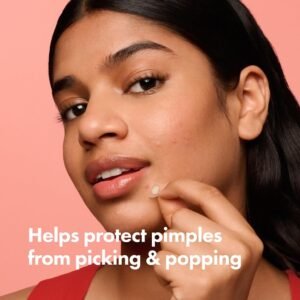 Close up of young woman with whitehead pimple on chin before applying Mighty Patch spot treatment